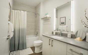 Polished quartz countertops in kitchen and bathrooms